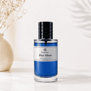 Blue Moon Eau de Parfum by RocheHayatt Luxury Perfumes in a blue glass bottle on a white marble pedestal with a soft beige minimalist background.