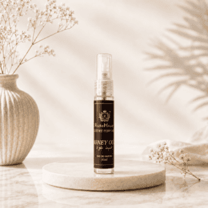 RocheHayatt Honey Oud Inspired by Arabic Oud 10ml Eau de Parfum on a luxury beige marble podium with soft floral background.
