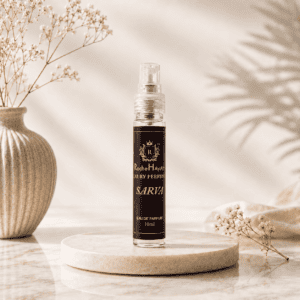 RocheHayatt Sarva Eau de Parfum 10ml inspired by Zara Patchouli displayed on a premium beige marble podium with a luxury minimalist background.